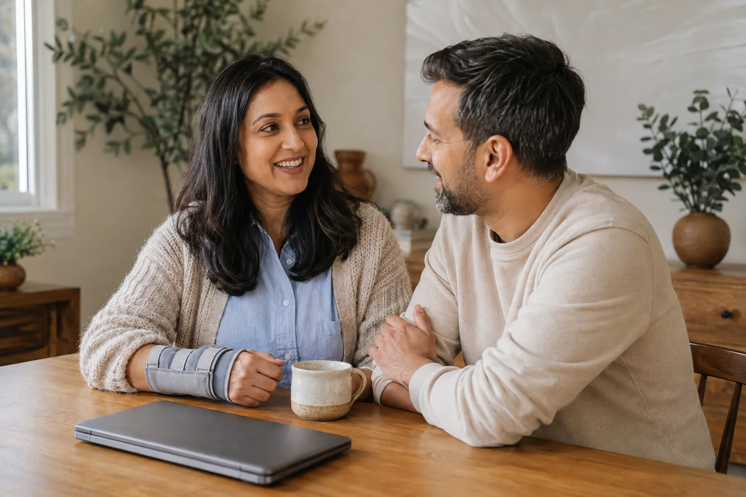 A woman recovering from a wrist injury sharing a quiet moment with her partner